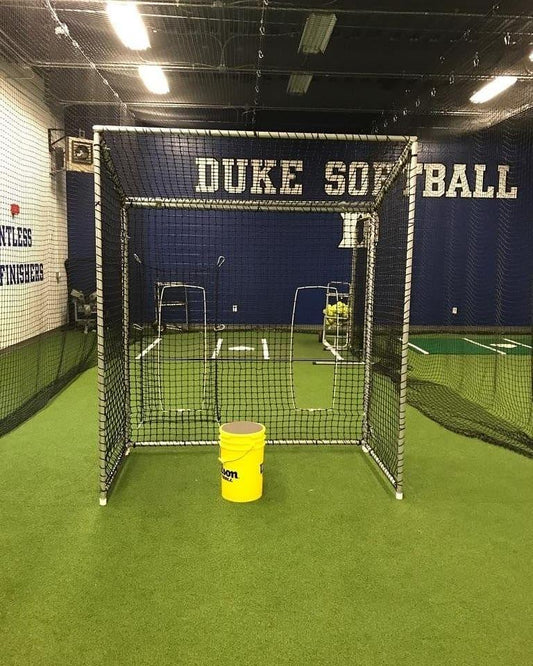 A yellow bucket is in front of the cage.