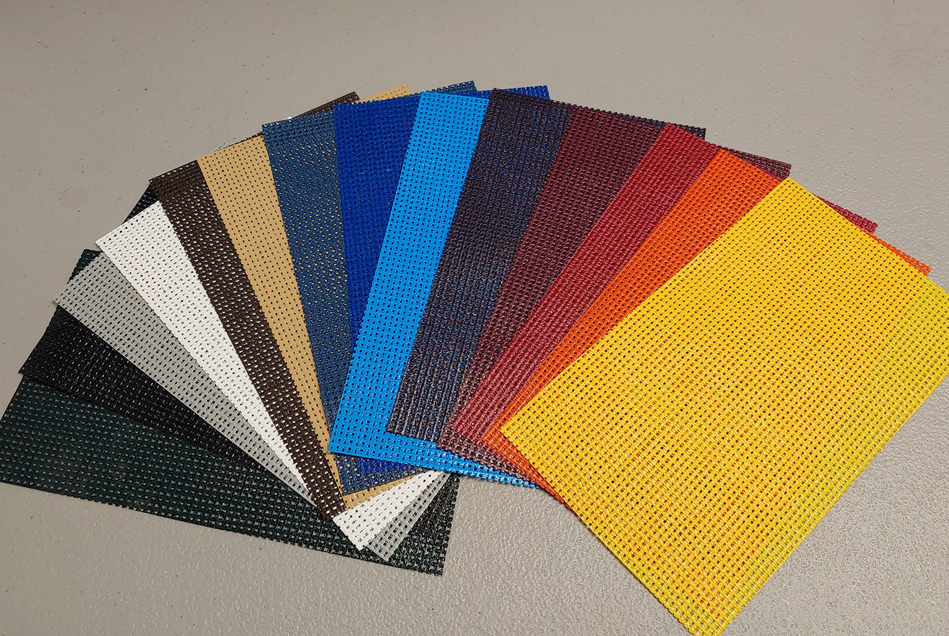 A group of different colored sheets of paper.