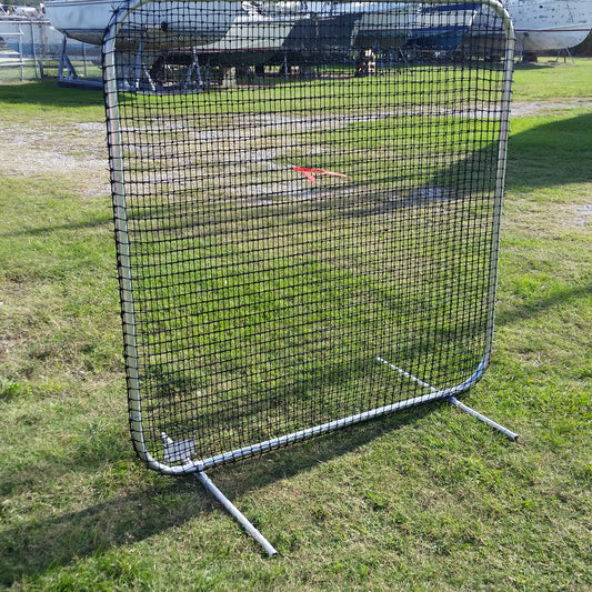 A baseball field with a metal frame and net.