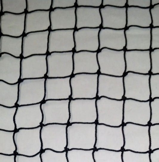 A black net is shown on top of a white surface.