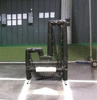 A chair in the middle of a baseball field.