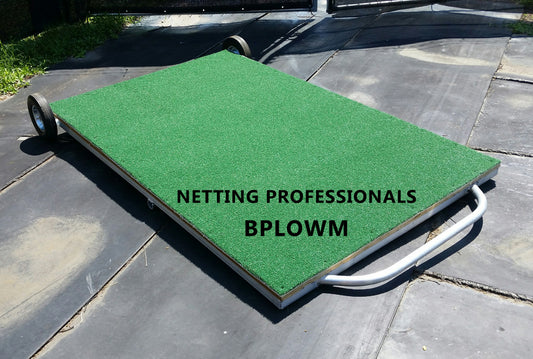A green mat on the ground with text that reads netting professionals bplowm