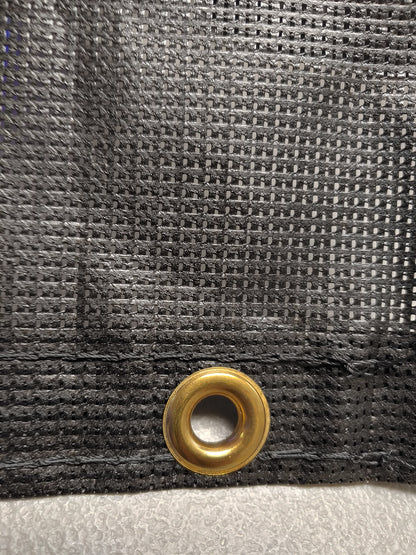 A close up of the fabric with a gold ring