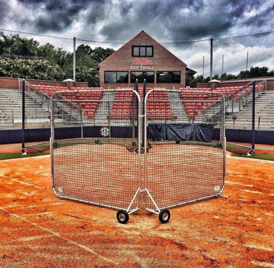 A baseball field with a net in the middle of it.