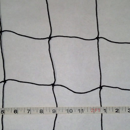 A white sheet with black netting and a ruler.