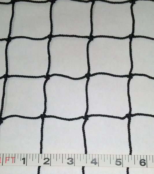 A white cloth with black netting on it.