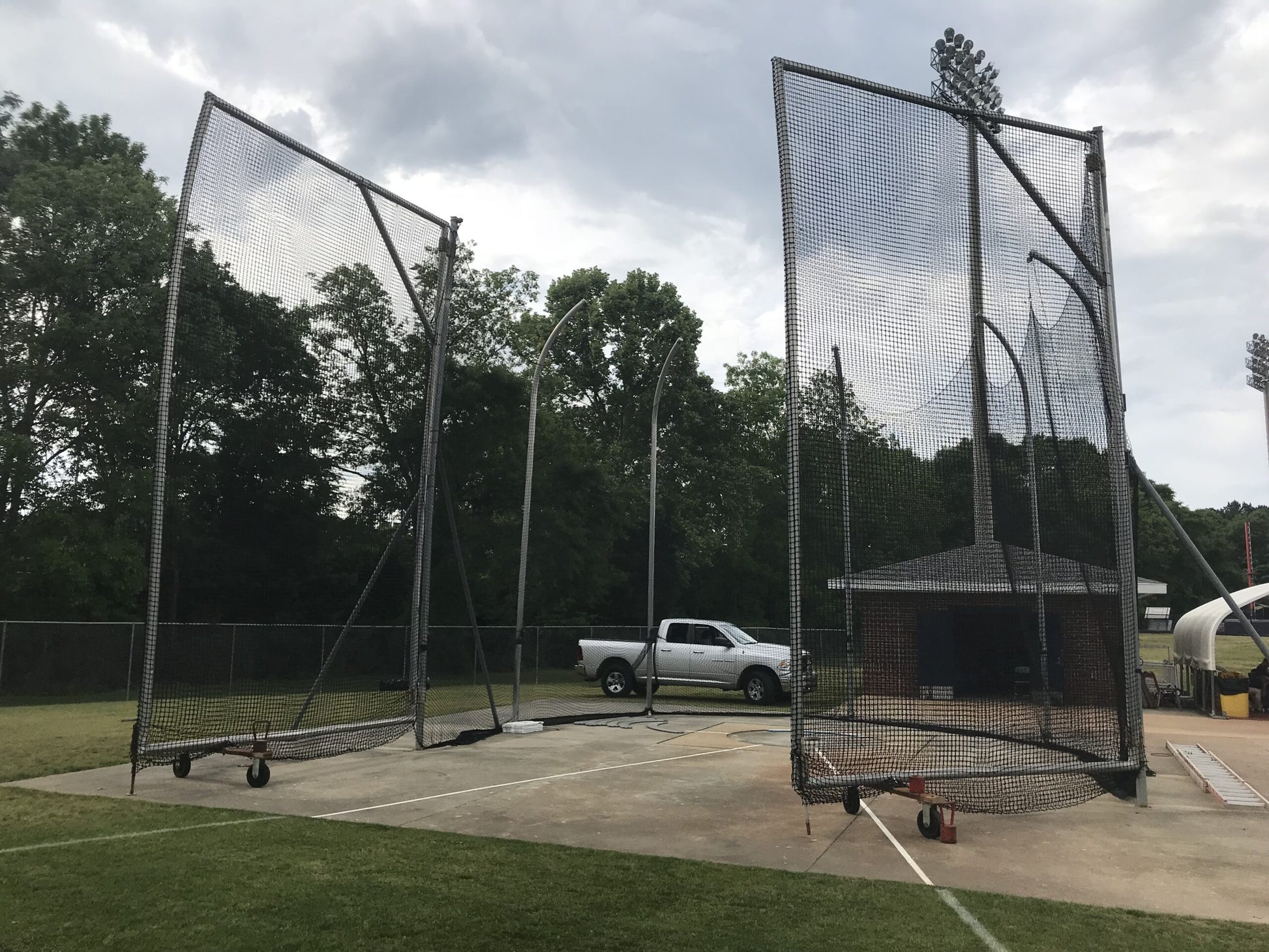 A truck parked in front of a cage.