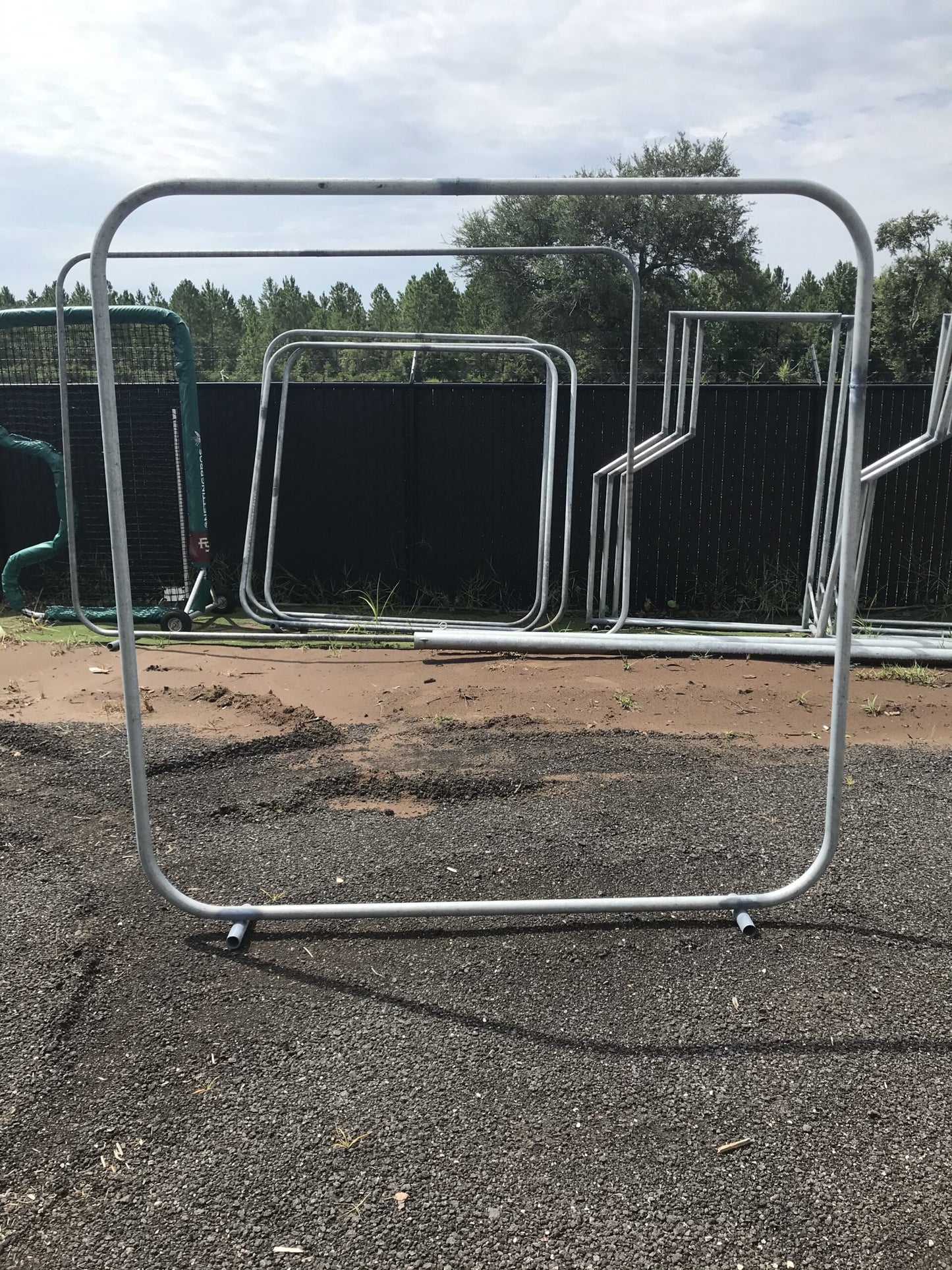 A metal frame in the middle of an empty lot.