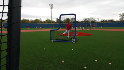 A baseball player is practicing his swing.