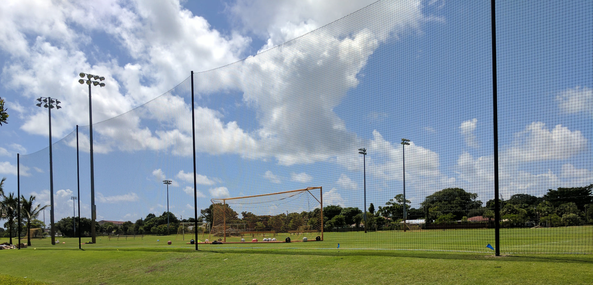 A soccer field with a goal post and some lights