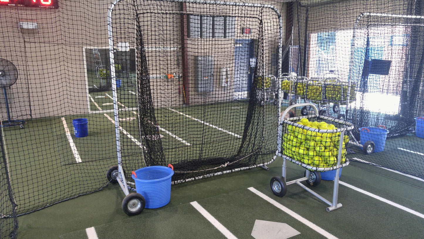 A cart with buckets and balls in it