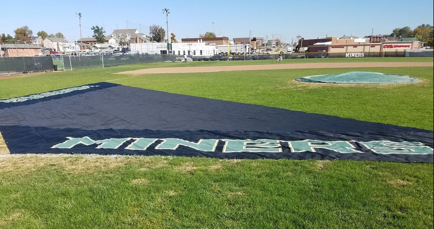 A baseball field with the name of the game on it.