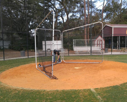 A baseball player is standing in the dirt.